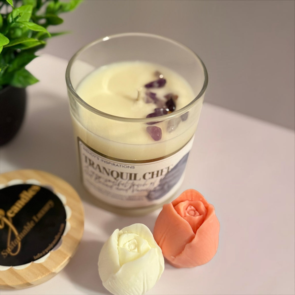 PMJ Candles Tranquil Chef scented candle in a glass jar with crystal toppings, accompanied by two rose-shaped wax melts