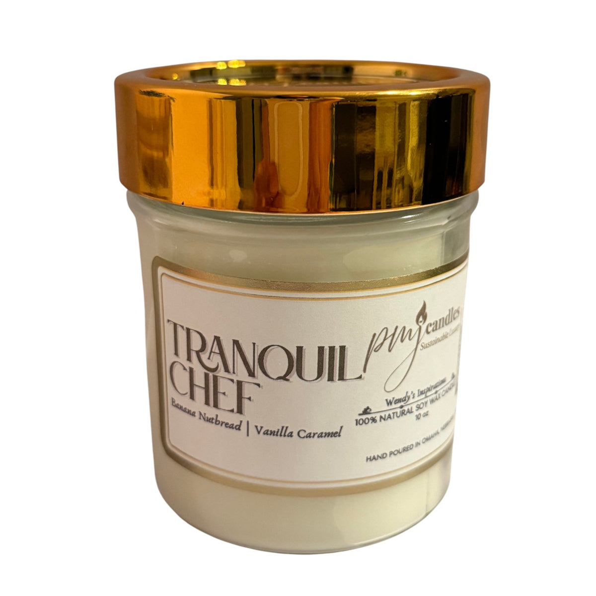 PMJ Candles Tranquil Chef soy wax candle in a glass jar with a reflective gold lid and banana nut bread scent label.